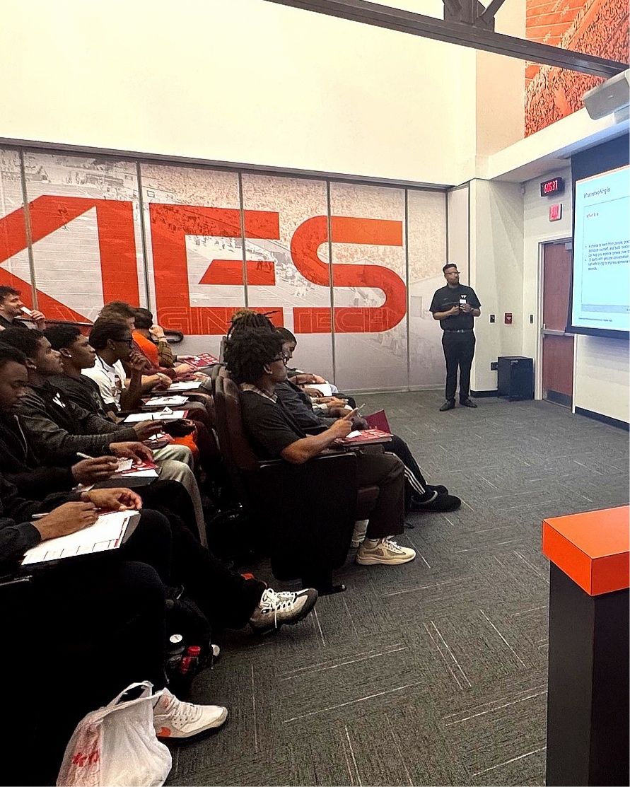 Edward Raimundi presenting to Virginia Tech football student-athletes during a career-readiness workshop.